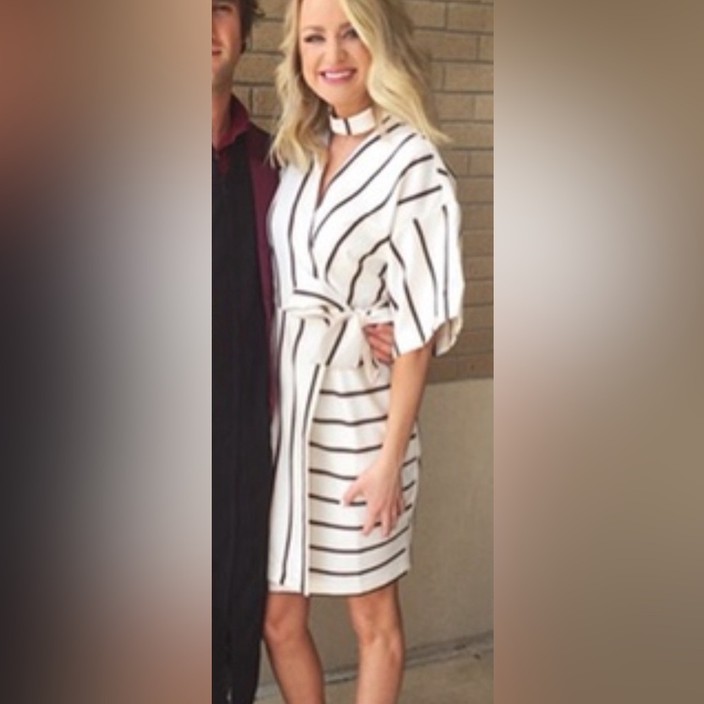 Brand new wore to one graduation indoors. Thick pinstripe wrap dress